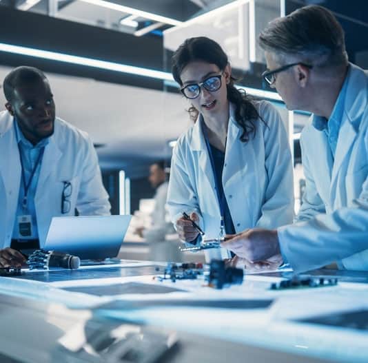 Advanced medical researchers collaborating in a modern laboratory environment, focusing on innovative healthcare solutions.